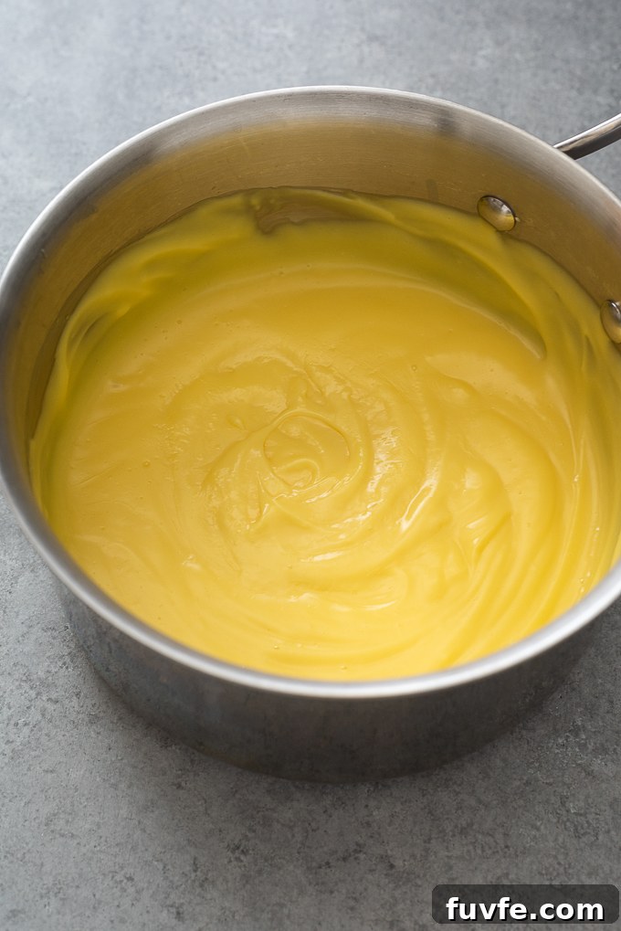 Cooked pastry cream in sauce pan.