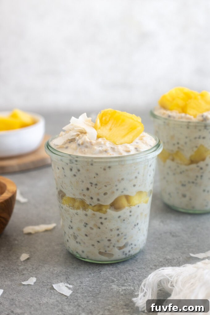 Pineapple overnight oats in a jar with coconut on top.