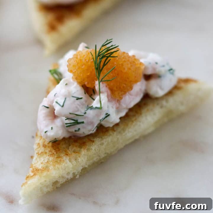 Close up of Toast Skagen topped with caviar.