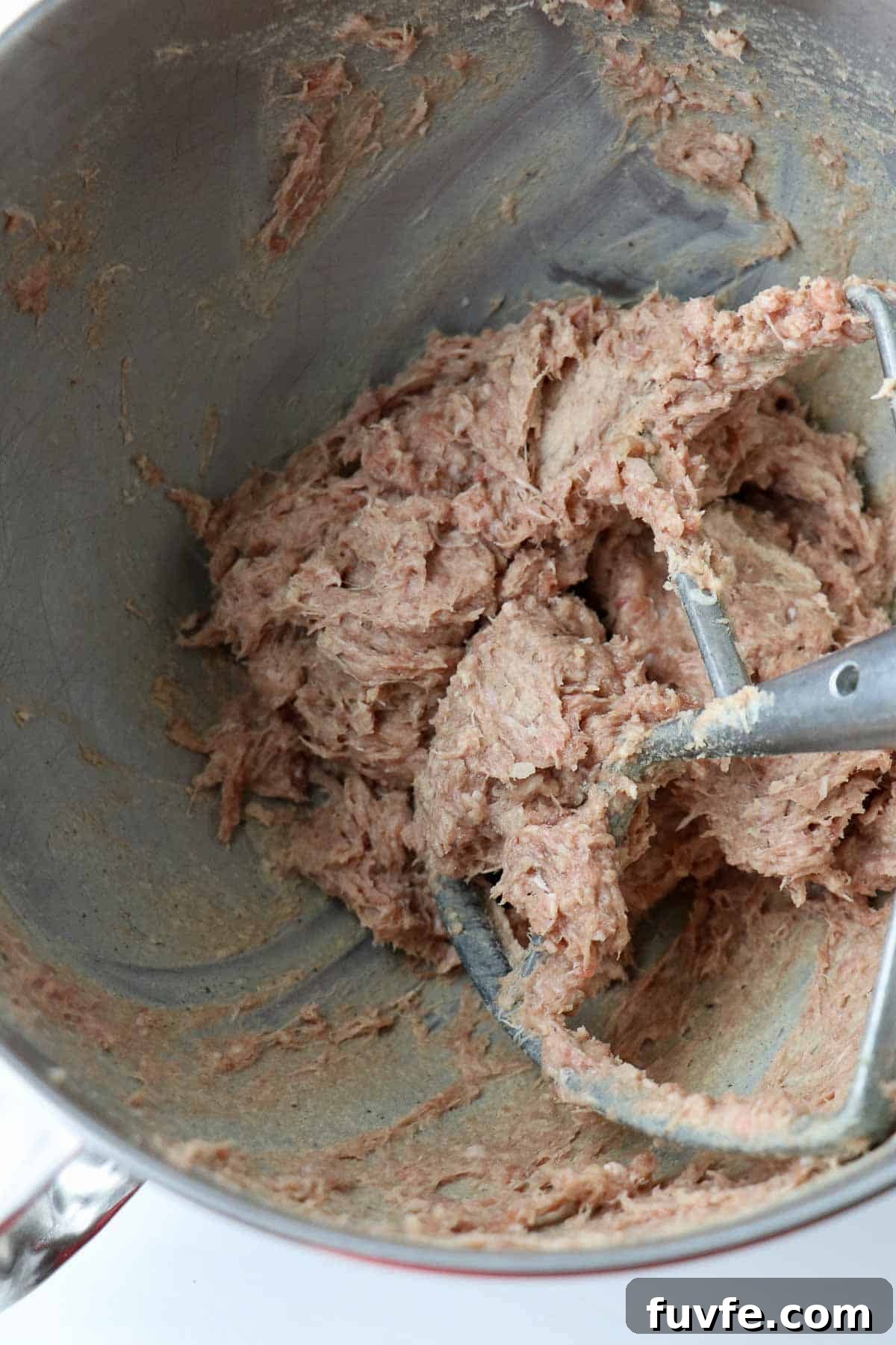 Swedish Meatballs with Classic Creamy Gravy (Köttbullar) 8 Mixed ingredients for Swedish Meatballs in a metal bowl with a paddle attachment.
