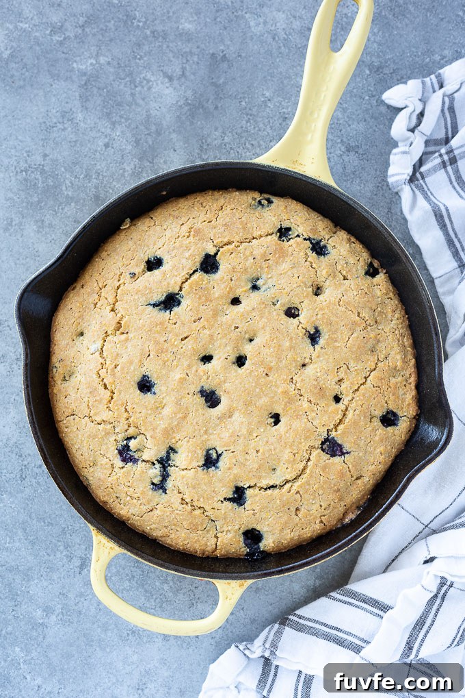Blueberry cornbread in a cast iron skillet