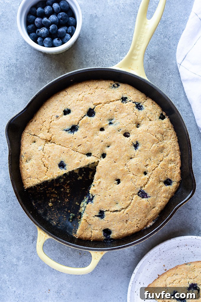 Skillet Blueberry Cornbread with wedge removed