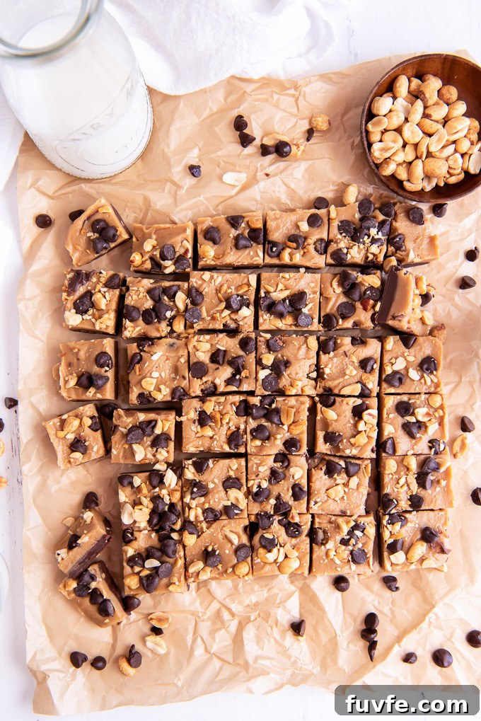 Homemade Chocolate Peanut Butter Fudge Recipe 5 Chocolate peanut butter fudge cut into small squares on parchment paper