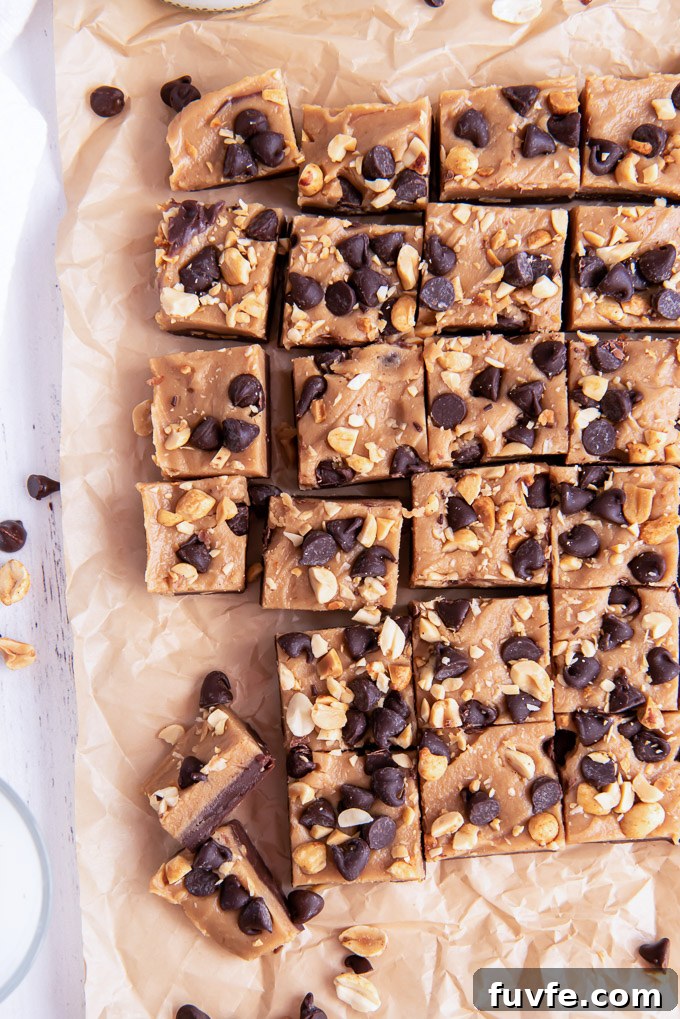 Homemade Chocolate Peanut Butter Fudge Recipe 7 Chocolate peanut butter fudge cut into squares on parchment paper