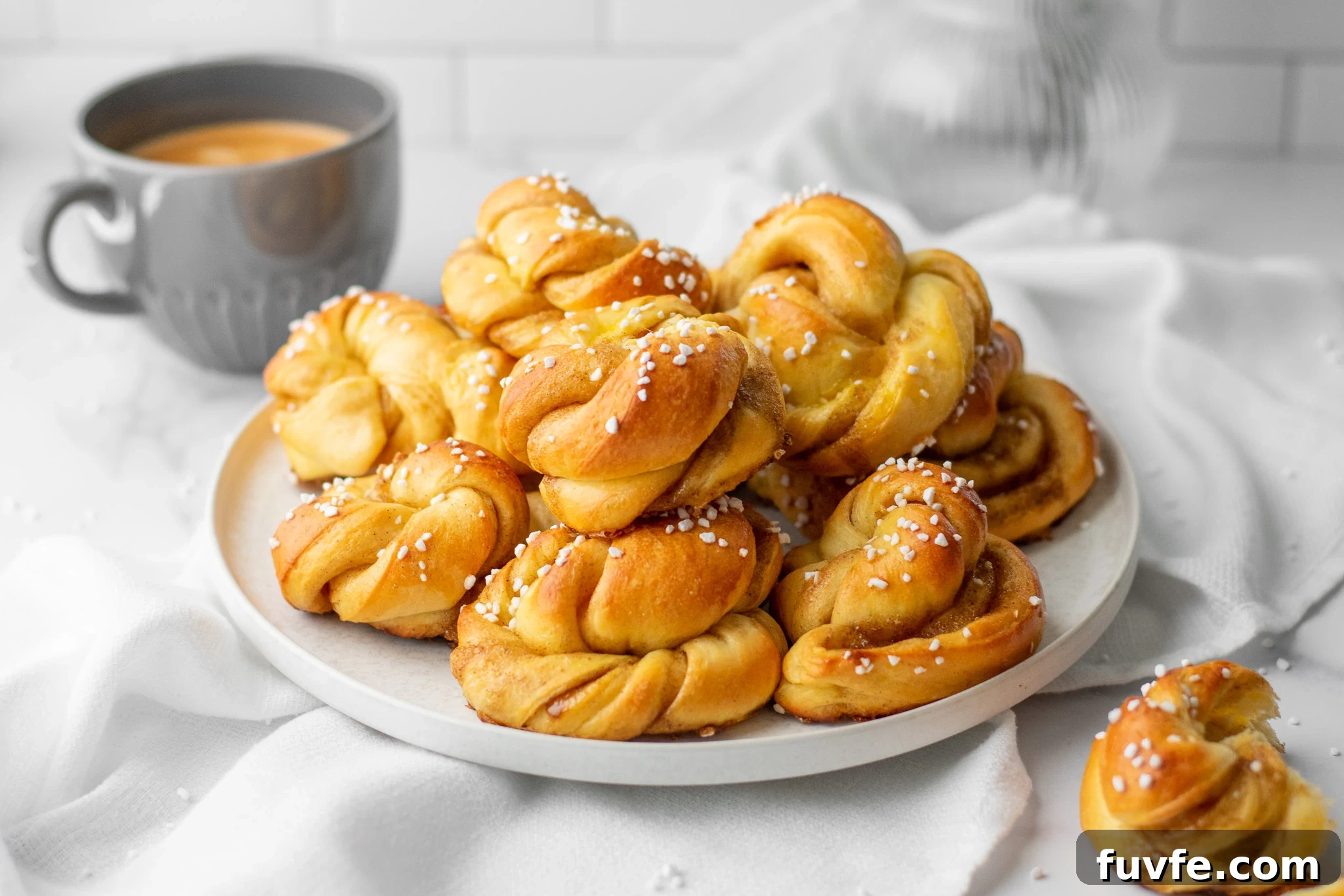 A stack of cardamom buns on a plate.