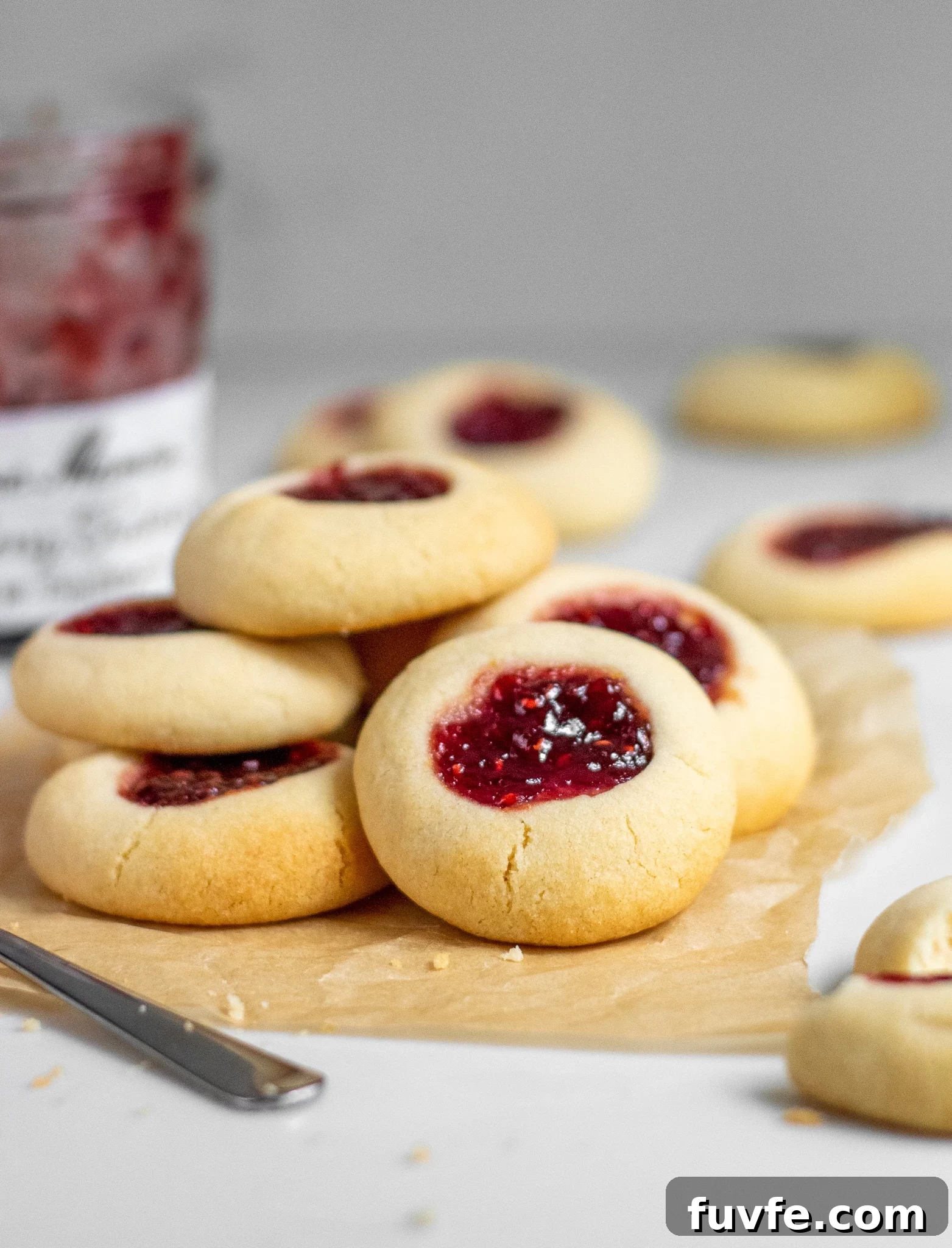 A stack of jam thumbprint cookies.