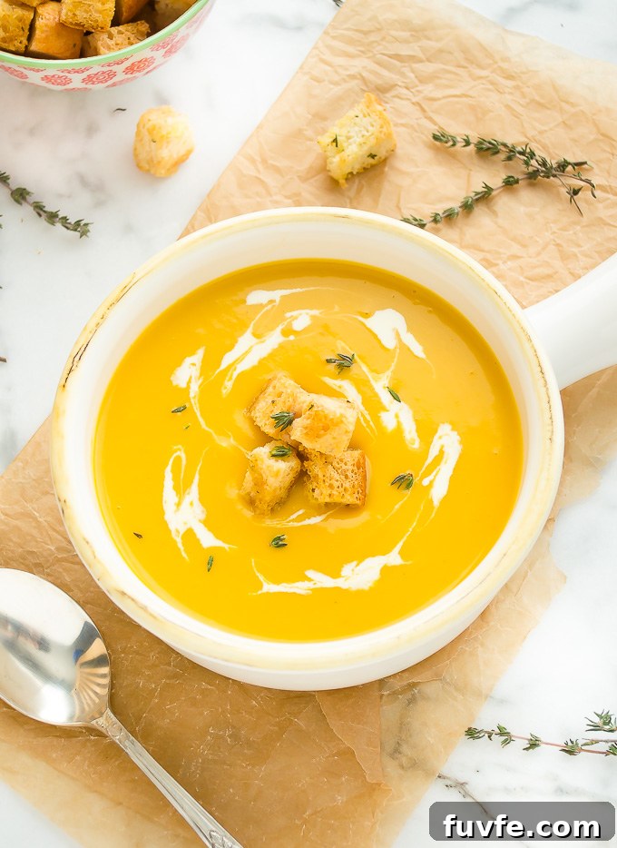 Creamy Butternut Squash, Potato and Leek Soup 6 Butternut squash potato soup in a bowl with creamy swirls