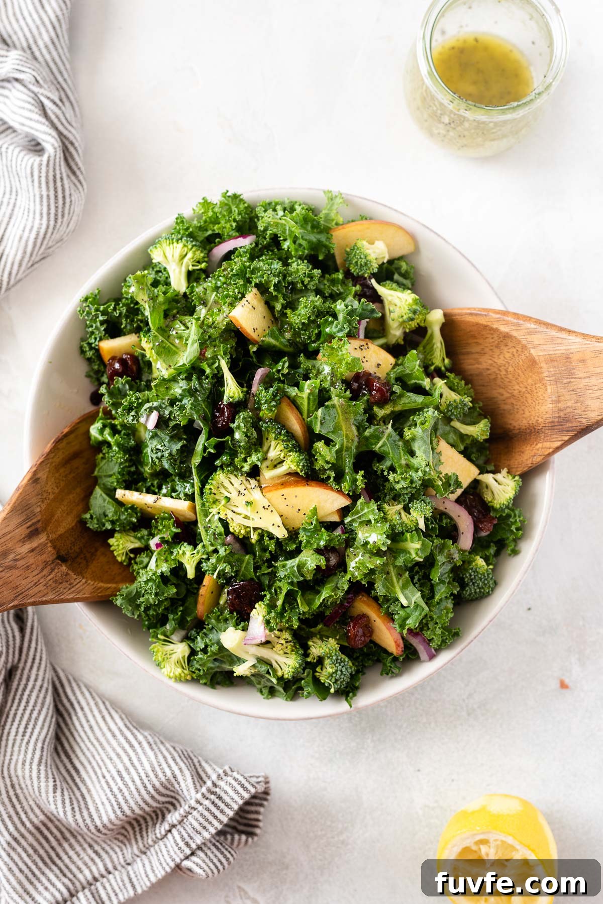 Crisp Broccoli and Kale Salad with Lemon Poppy Seed Dressing 5 broccoli and kale salad in white bowl with servers