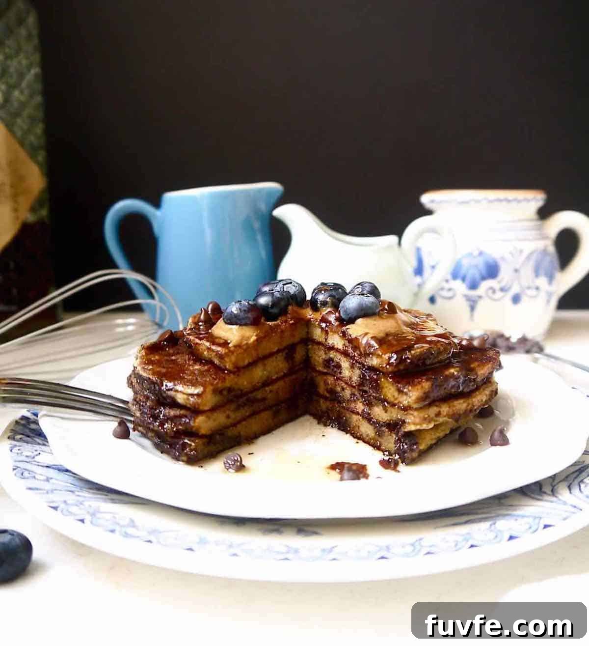 Dairy-free banana pancakes with a chunk cut out of it.