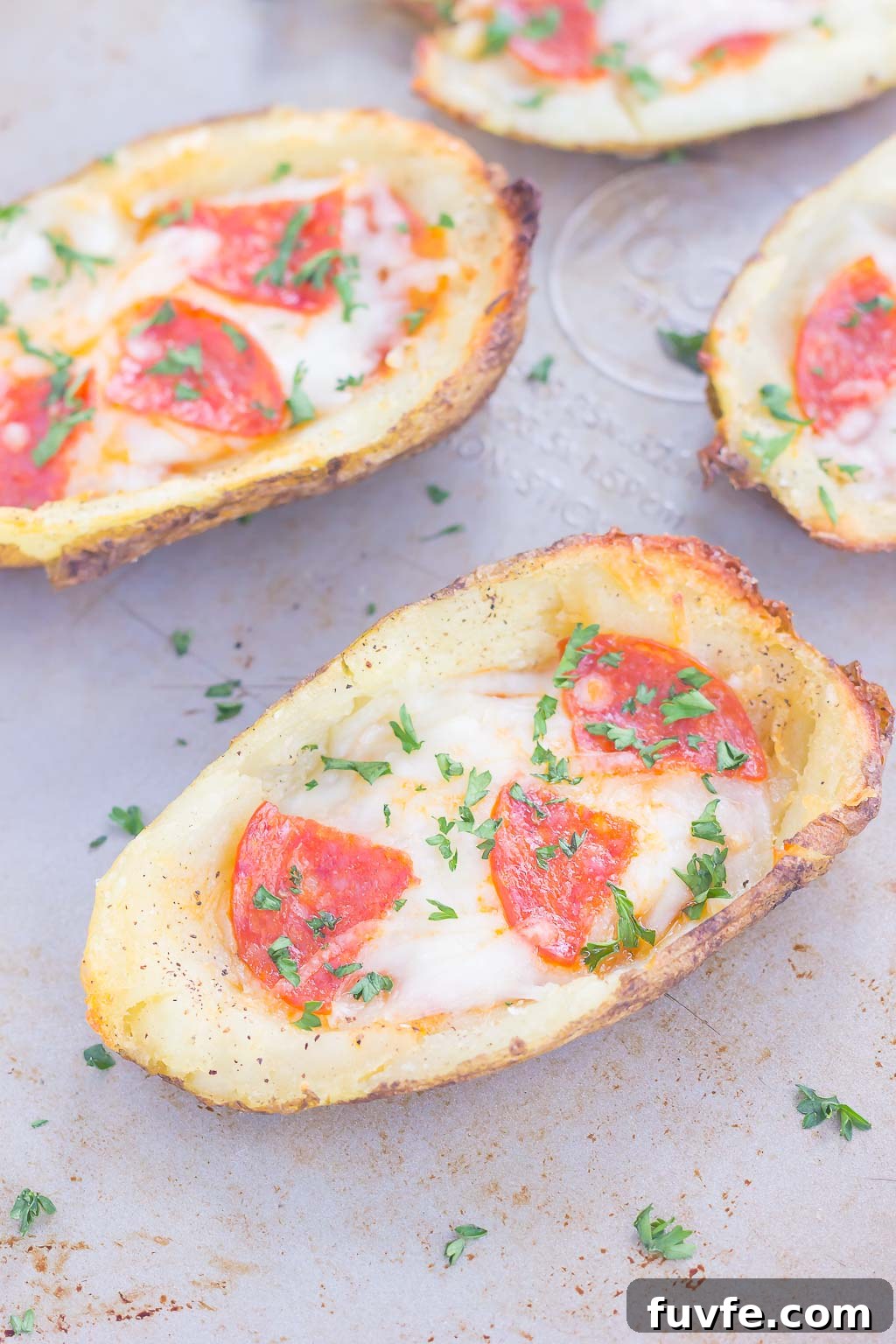 Pizza potato skins on baking sheet