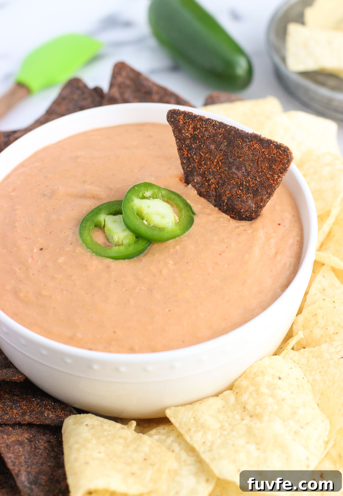 Cheesy salsa bean dip in bowl