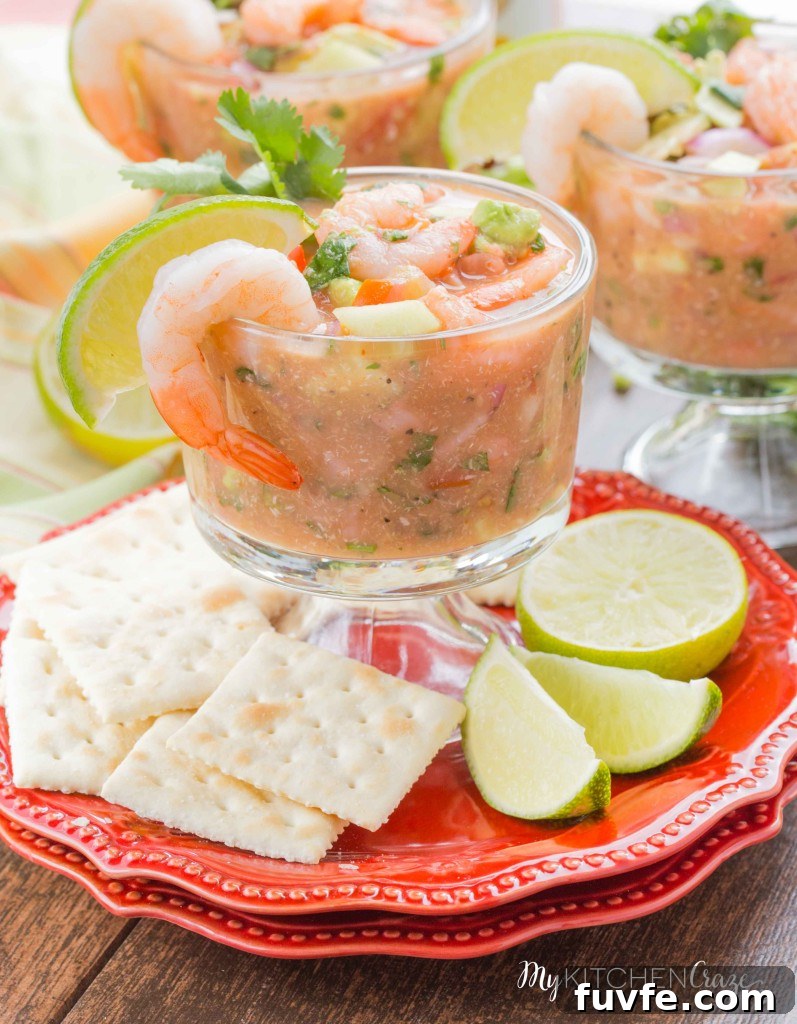 Mexican shrimp cocktail in a glass with lime and cilantro