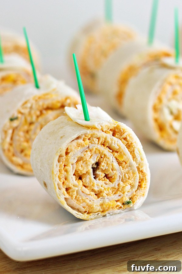 Buffalo chicken tortilla pinwheels on a white plate