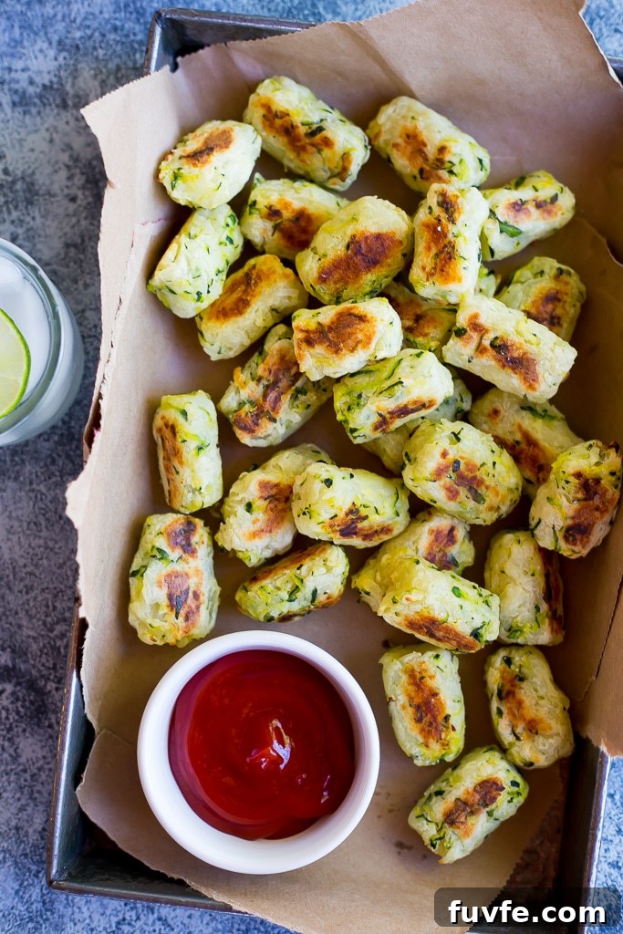 Zucchini tots in a box with ketchup