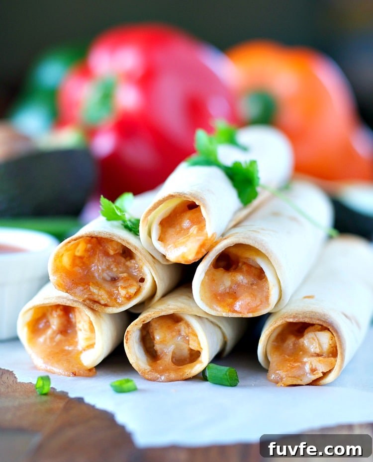 4 Ingredient Chicken Taquitos piled on a plate