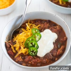 Slow cooker turkey chili in a bowl with toppings