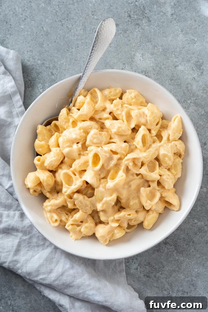 15-Minute Creamy Stovetop Mac and Cheese 2 Stove top mac and cheese in a white bowl
