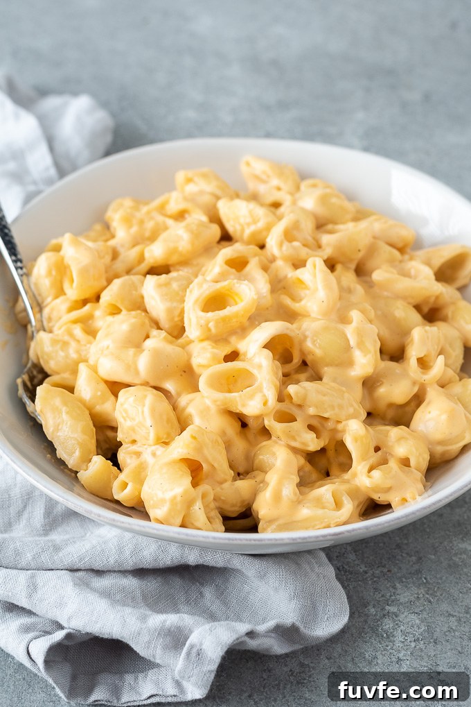 15-Minute Creamy Stovetop Mac and Cheese 8 One pot mac and cheese in a bowl with serving spoon