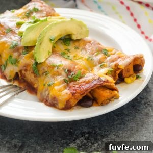 Black Bean Sweet Potato enchiladas on a plate with avocado