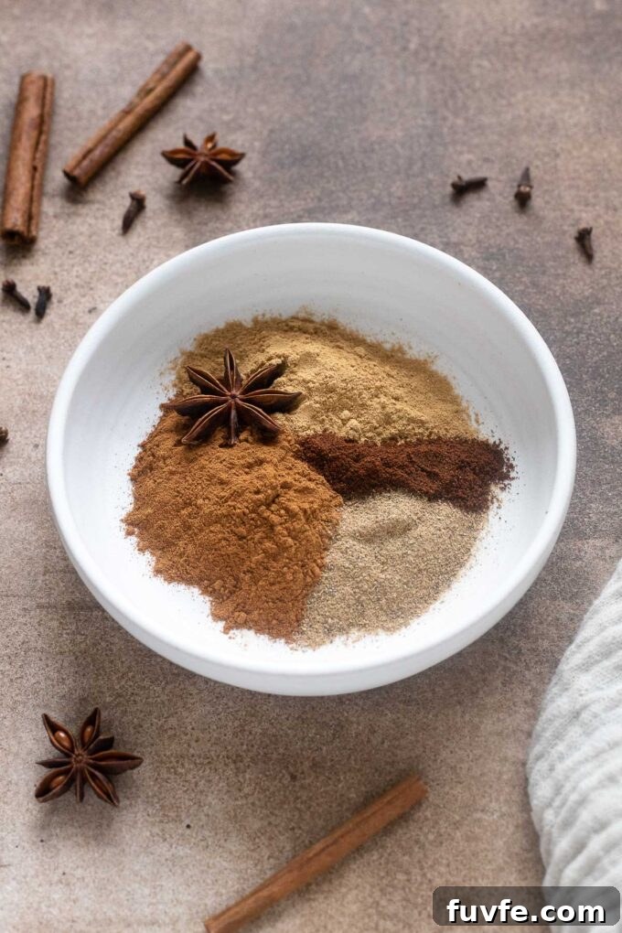 Chai spice blend in a bowl with star anise on top.