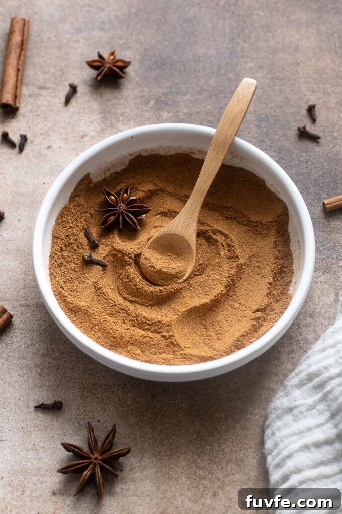 Bowl of chai spice mix with spoon digging in.