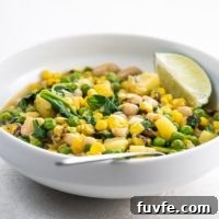 Hearty White Bean Stew with Potatoes and Sweet Corn 6 white bean stew with potatoes and corn in a white bowl with a spoon