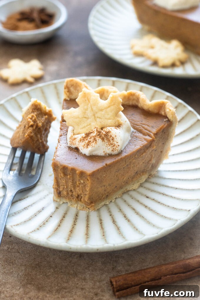 Spiced chai pumpkin pie on a plate.
