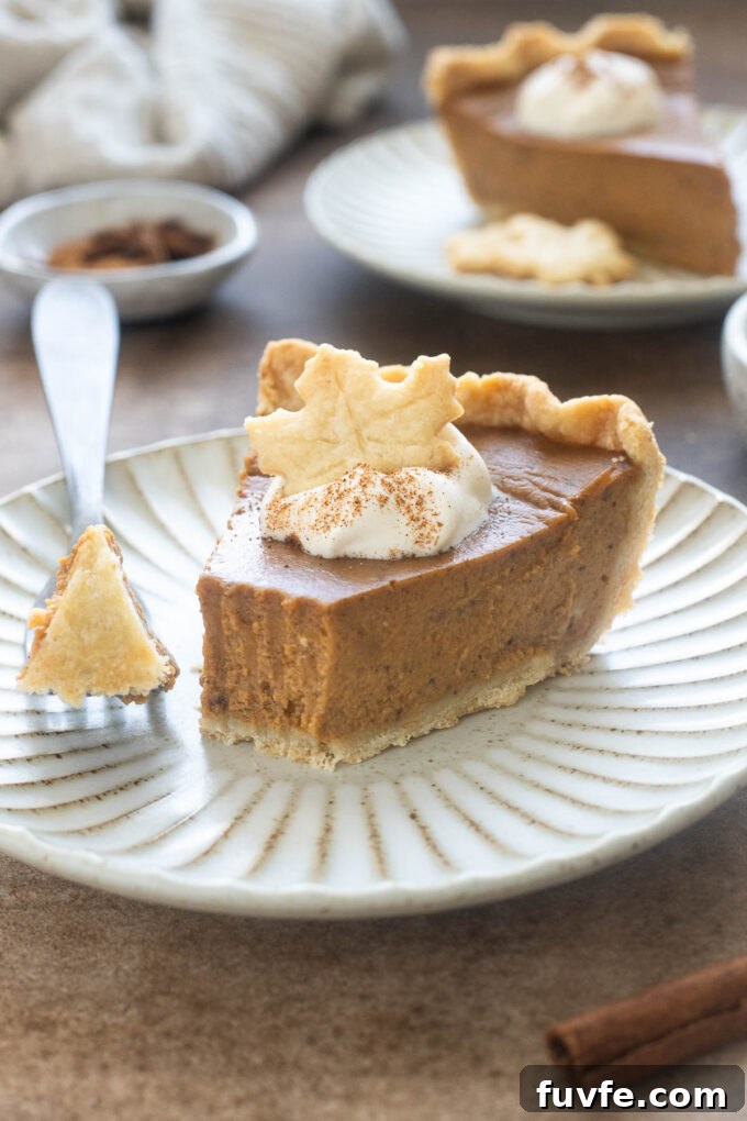 Chai-Spiced Pumpkin Pie Recipe with Gingersnap Crust 8 Pumpkin maple pie topped with whipped cream and maple leaf pastry.