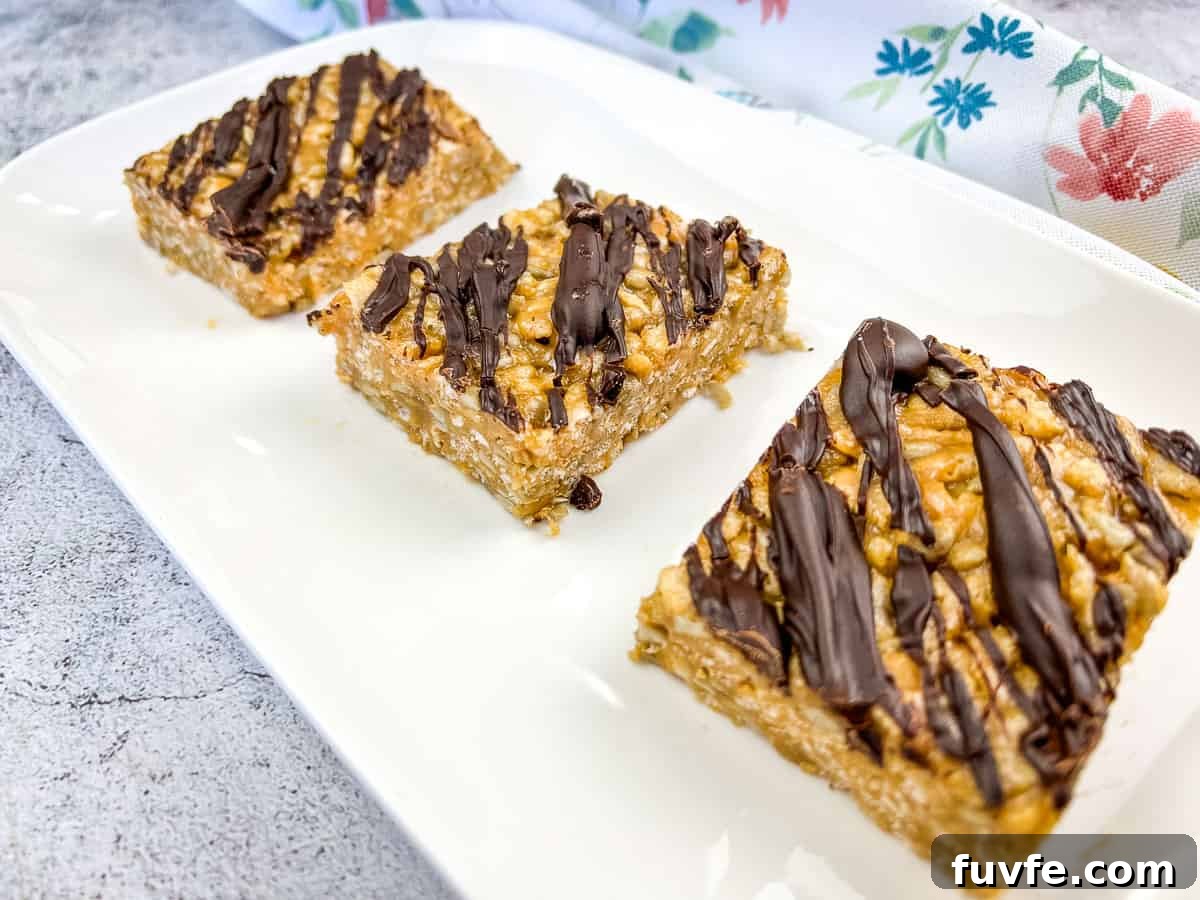 29 Christmas Baking Ideas for Home Bakers Who Love a Busy Oven 15 Four pieces of molly bars on a white plate.
