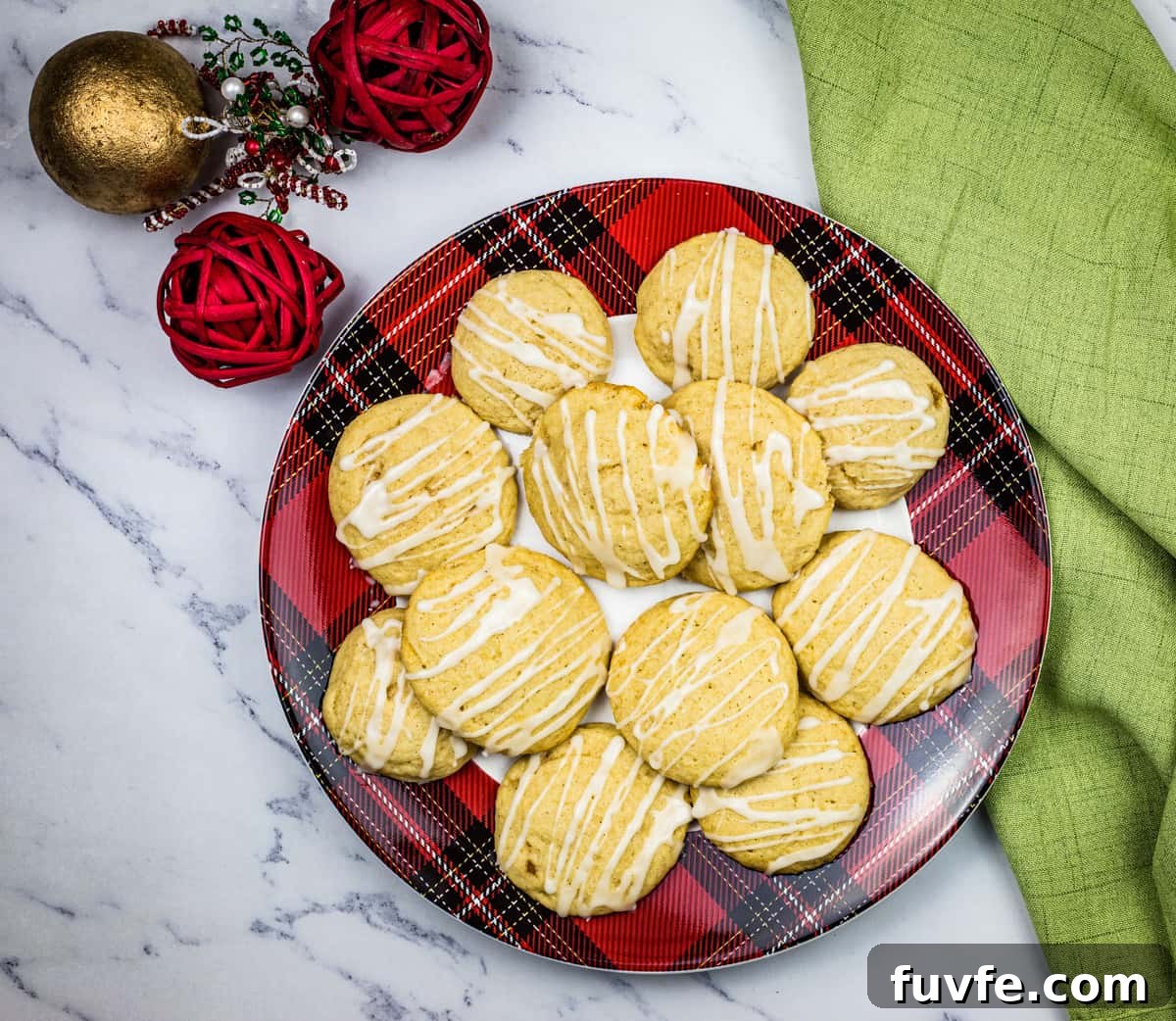 29 Christmas Baking Ideas for Home Bakers Who Love a Busy Oven 3 A plate of eggnog cookies with with spiced rum glaze on top.