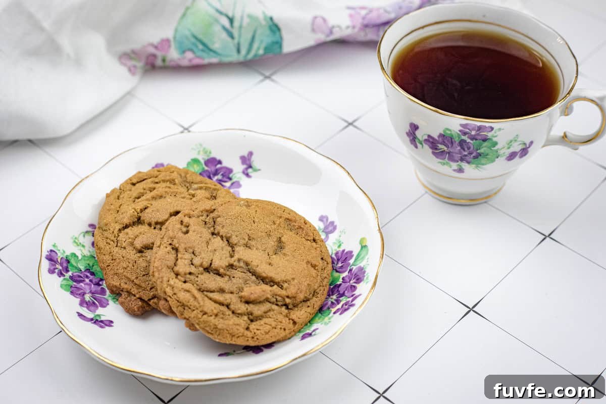 29 Christmas Baking Ideas for Home Bakers Who Love a Busy Oven 22 A plate of Spiced Ginger Cookies and a cup of tea.