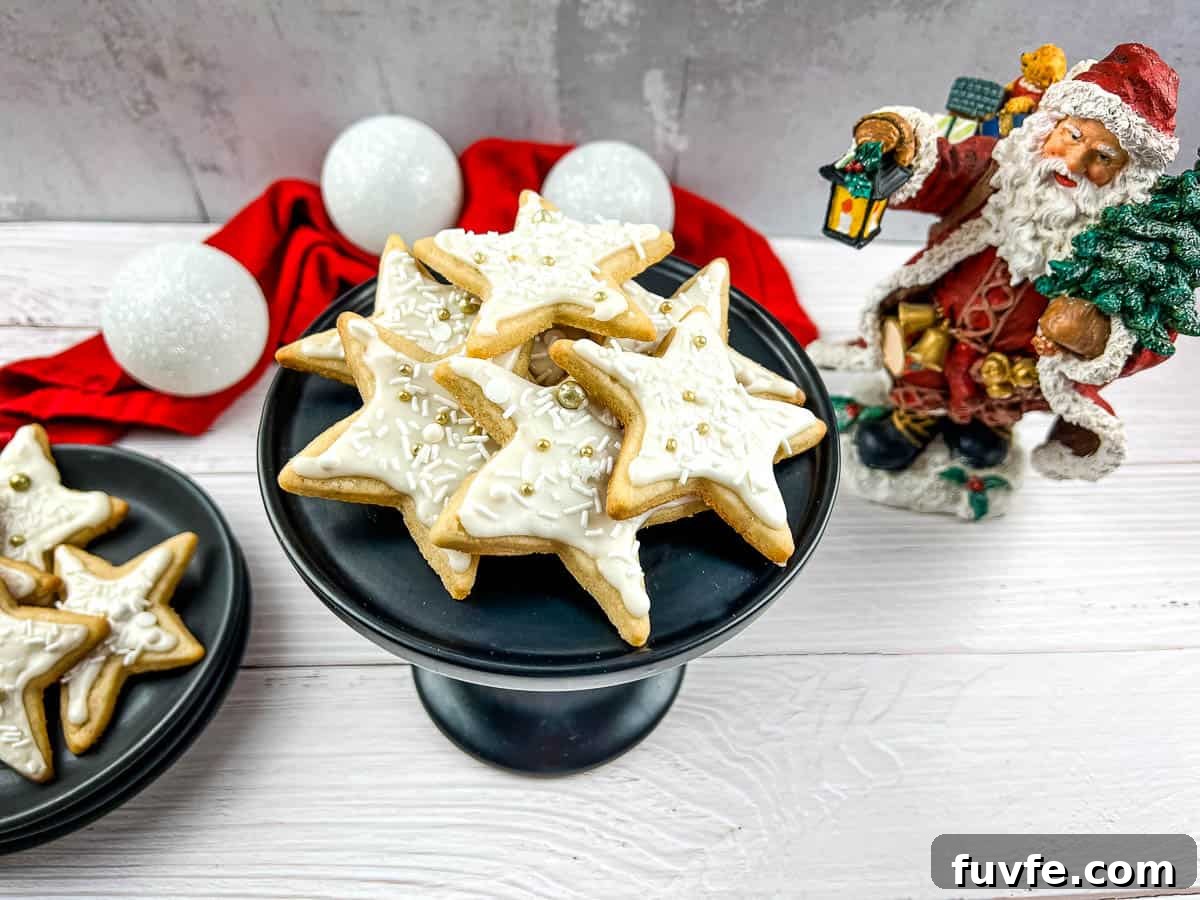 29 Christmas Baking Ideas for Home Bakers Who Love a Busy Oven 24 Eggnog sugar cookies on a plate with santa claus figurines.
