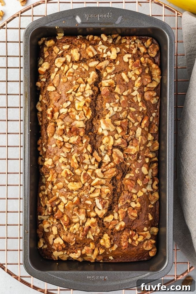 One-Bowl Banana Nut Bread Recipe (No Mixer) 6 Loaf of banana nut bread on a cooling rack