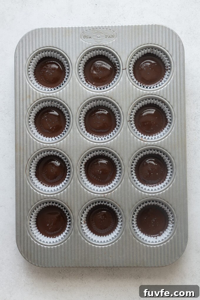 Homemade Protein Peanut Butter Cups 10 Assembled peanut butter cups in muffin pan before chilling.