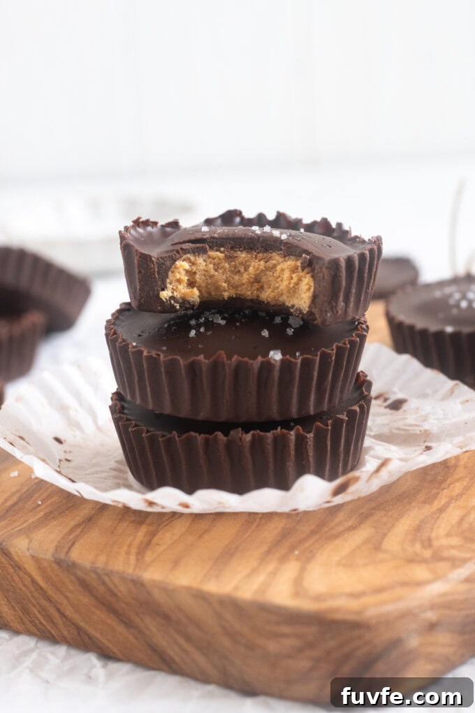 Homemade Protein Peanut Butter Cups 12 Close-up of a halved protein peanut butter cup showing creamy peanut butter and protein filling.