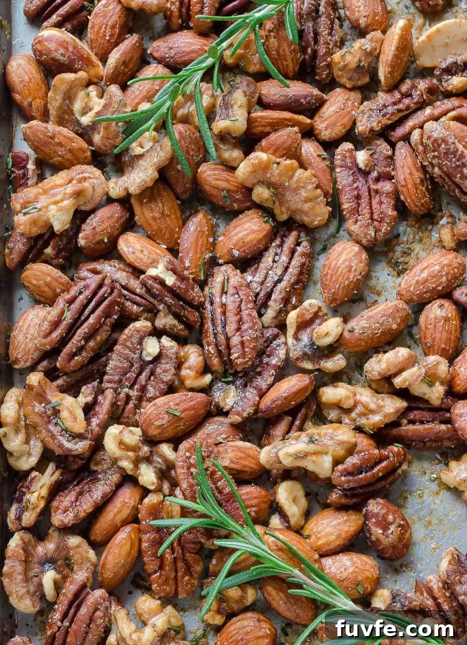 roasted almonds, walnuts and pecans on a baking sheet