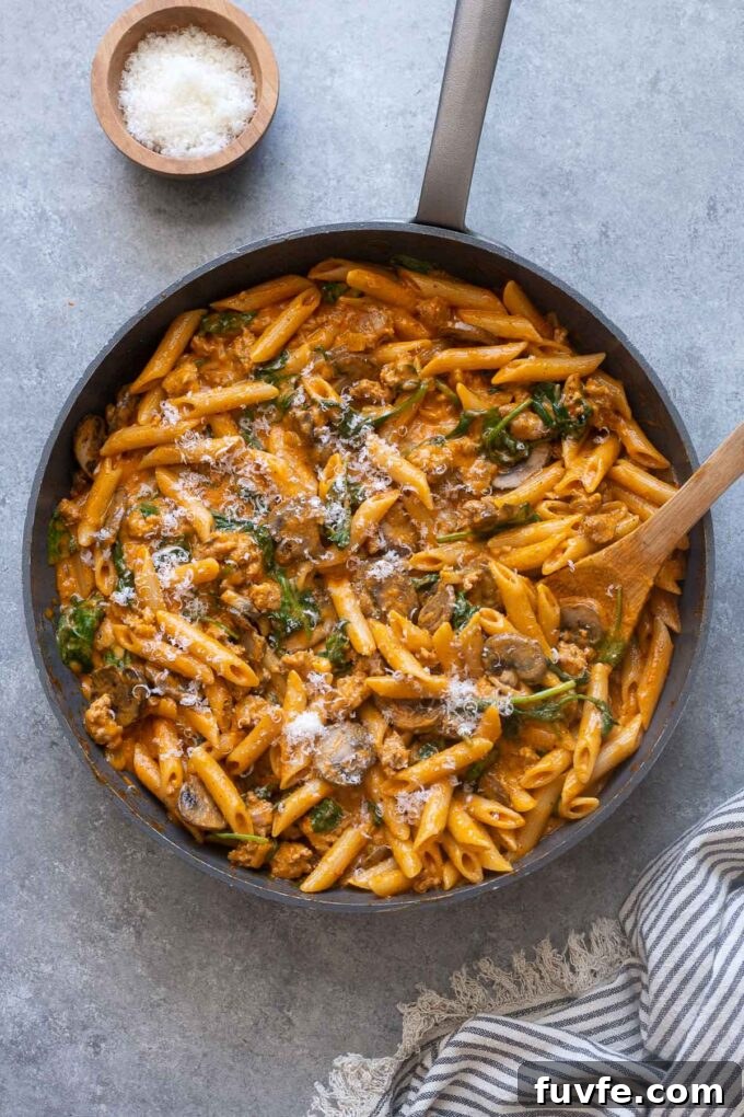 One pot roasted red pepper pasta in a skillet.