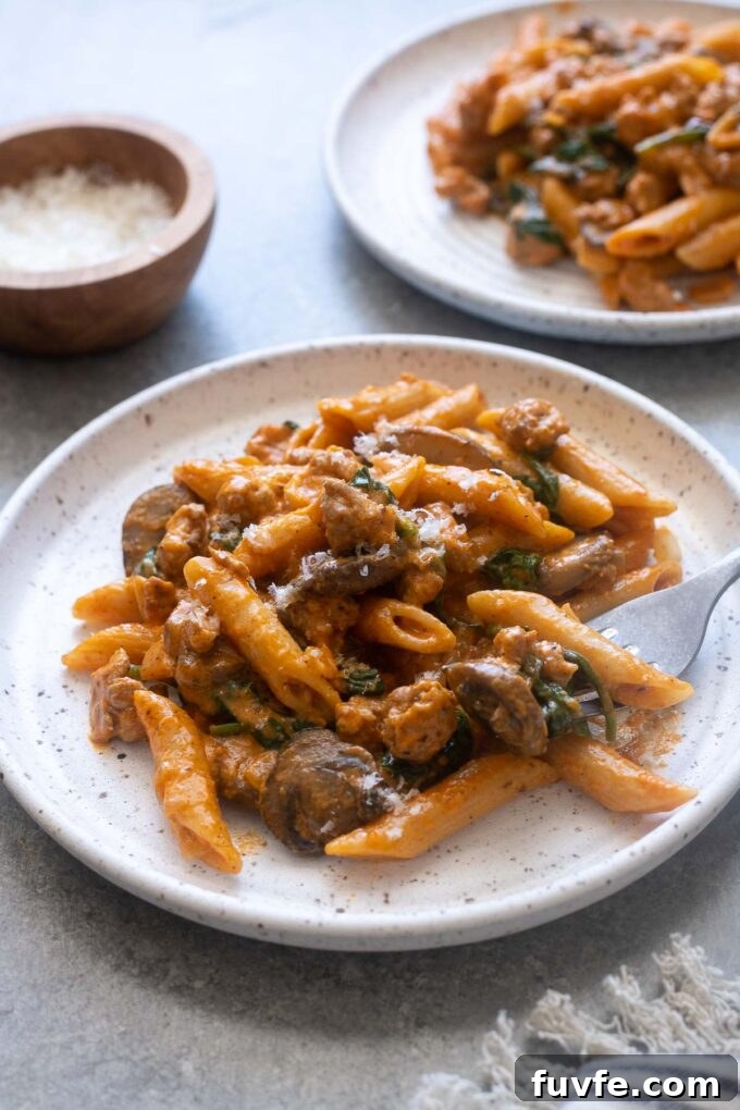 Roasted red pepper pasta on a plate.