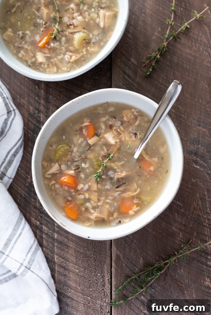 Turkey wild rice soup in a bowl with a spoon