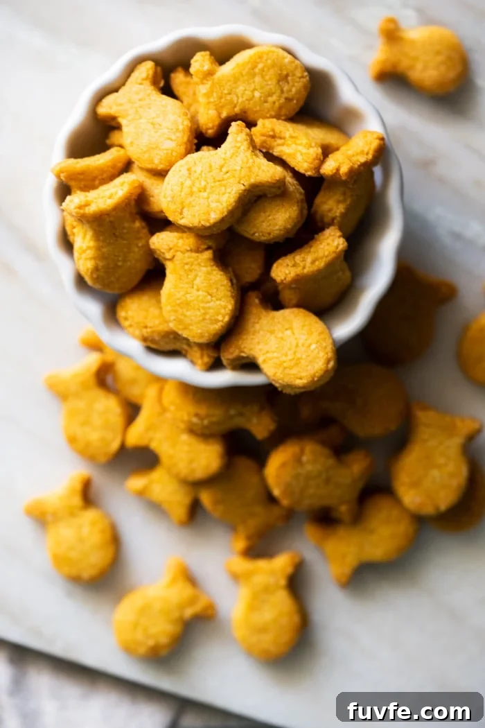 Homemade keto goldfish crackers in a white serving bowl