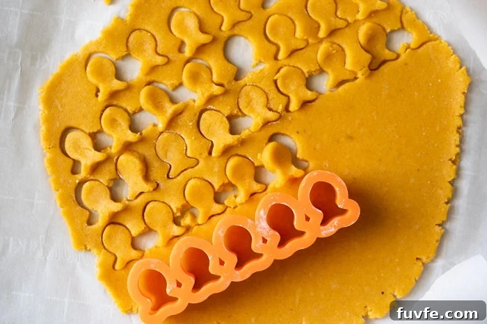 Cutting out goldfish with cookie cutter