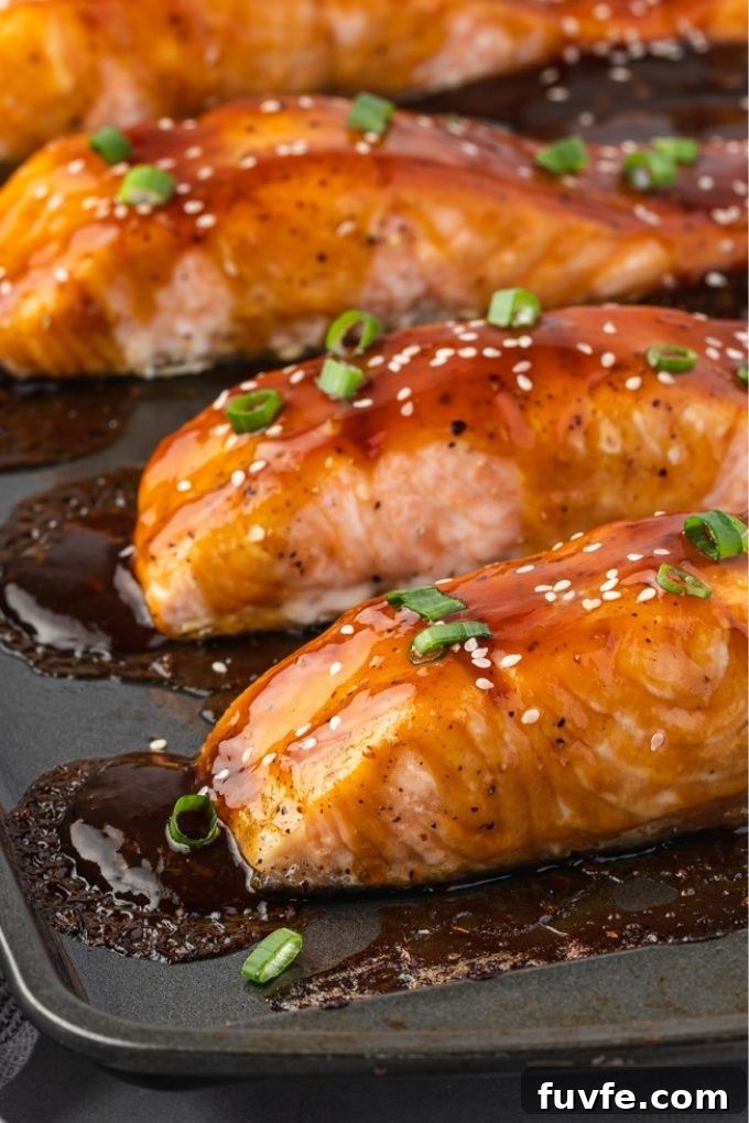 Crispy Oven-Baked Teriyaki Salmon Recipe with Sticky Glaze 6 Baked teriyaki salmon on a sheet pan