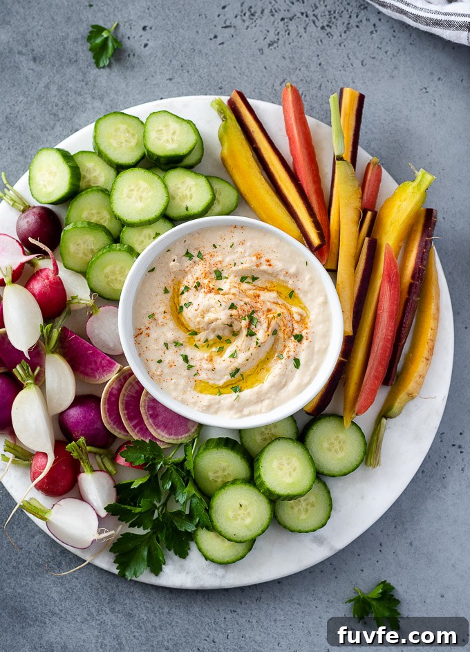 White bean hummus on a platter with veggies