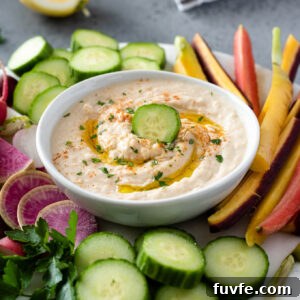 White bean hummus in a bowl with veggies