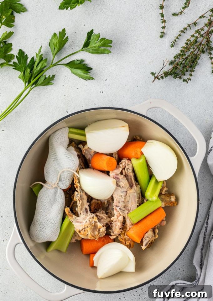 Flavorful Homemade Chicken Stock Recipe for Soups and Sauces 4 Chicken stock ingredients in a pot