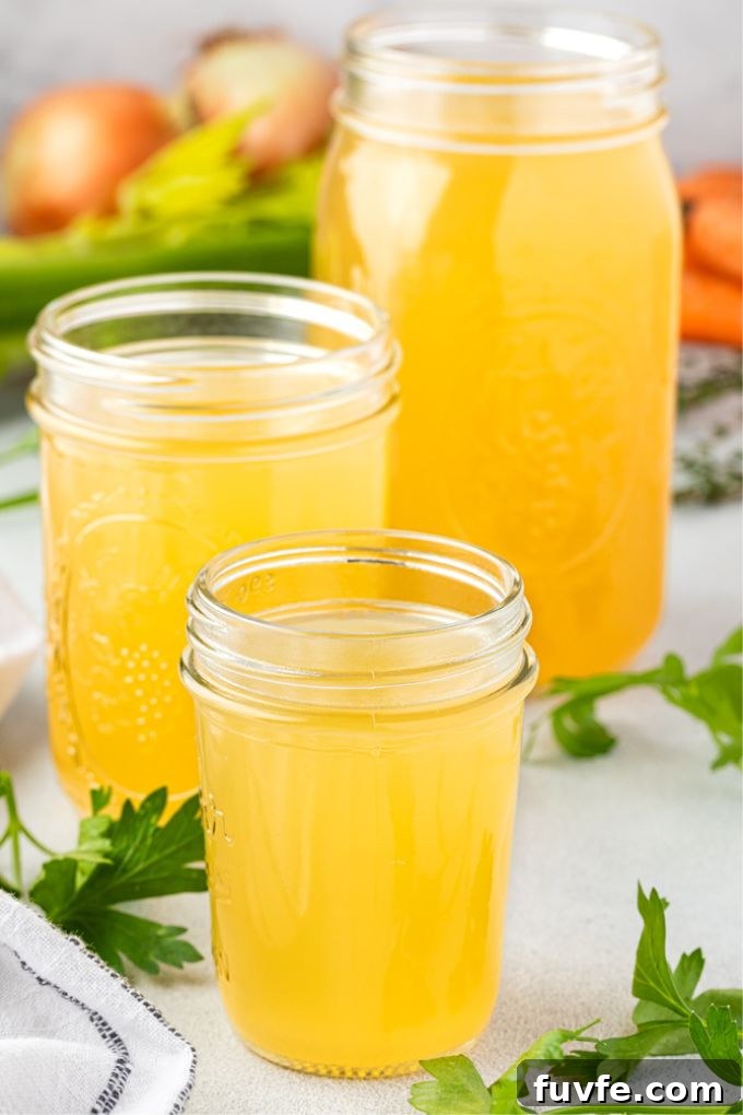 Chicken stock stored in various sized jars