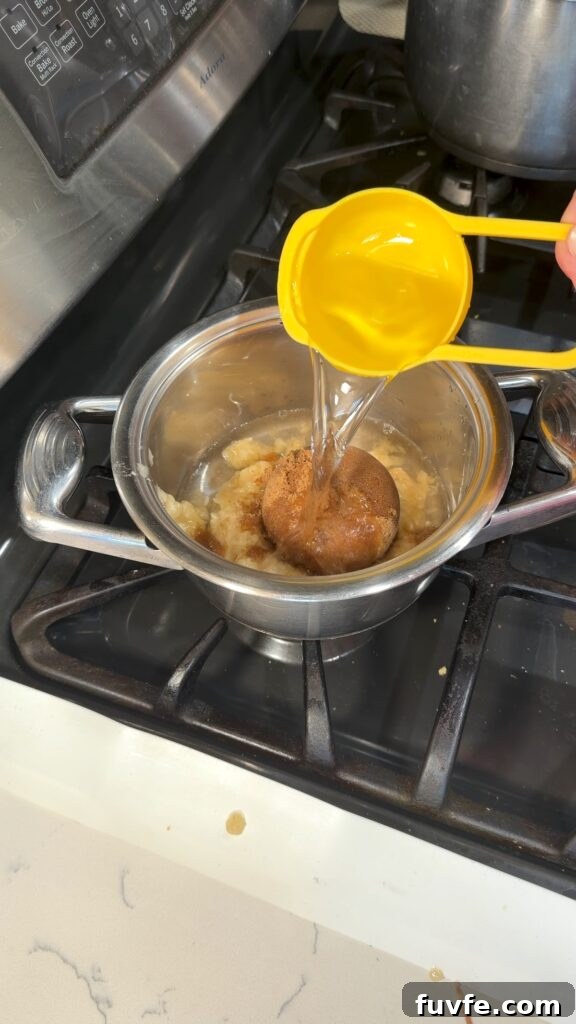 Banana Bread Latte Syrup Recipe — Homemade Coffee Flavoring 5 adding water to the mashed banana and brown sugar