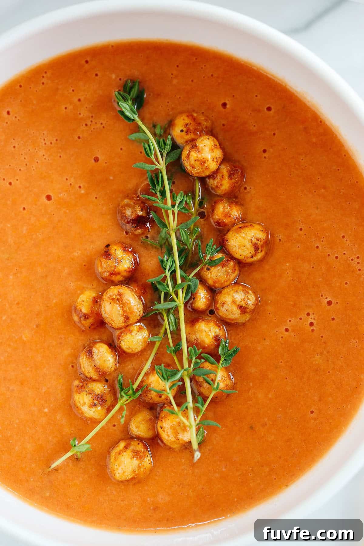 This Creamy Tomato Hummus Detox Soup is the perfect remedy for cold and flu season that is filled with tons of antioxidants and immune-boosting ingredients to keep you healthy all season long!