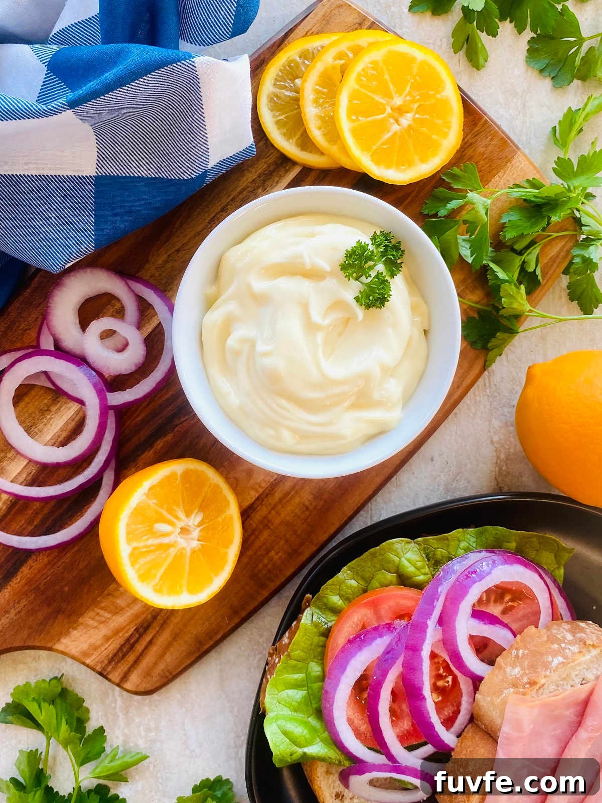 Homemade Mayonnaise Recipe: Smooth, Creamy, and Stable 2 mayonaise in bowl on a cutting board.