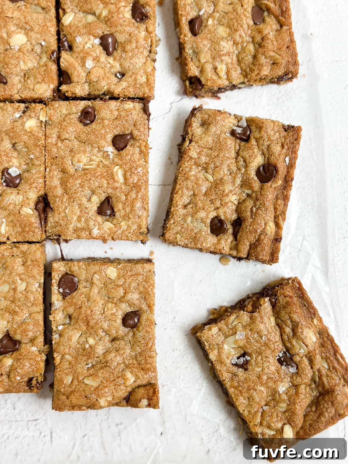 a few brown butter oatmeal cookie bars cut and scattered.